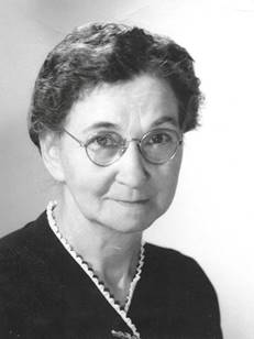 A black and white photo of a person
Description automatically generated